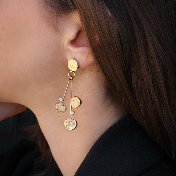 Sabres shape hanging gold & diamonds earrings