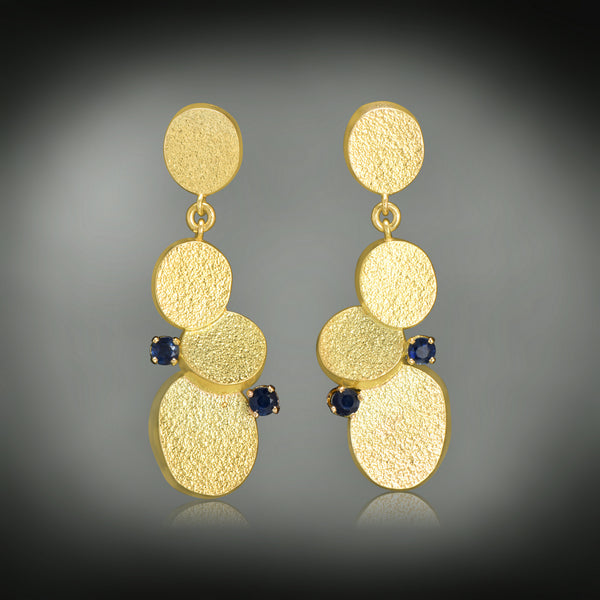 Sabres shape gold earrings