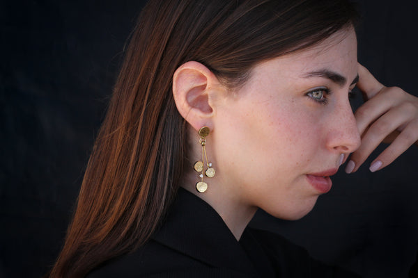 Sabres shape hanging gold & diamonds earrings